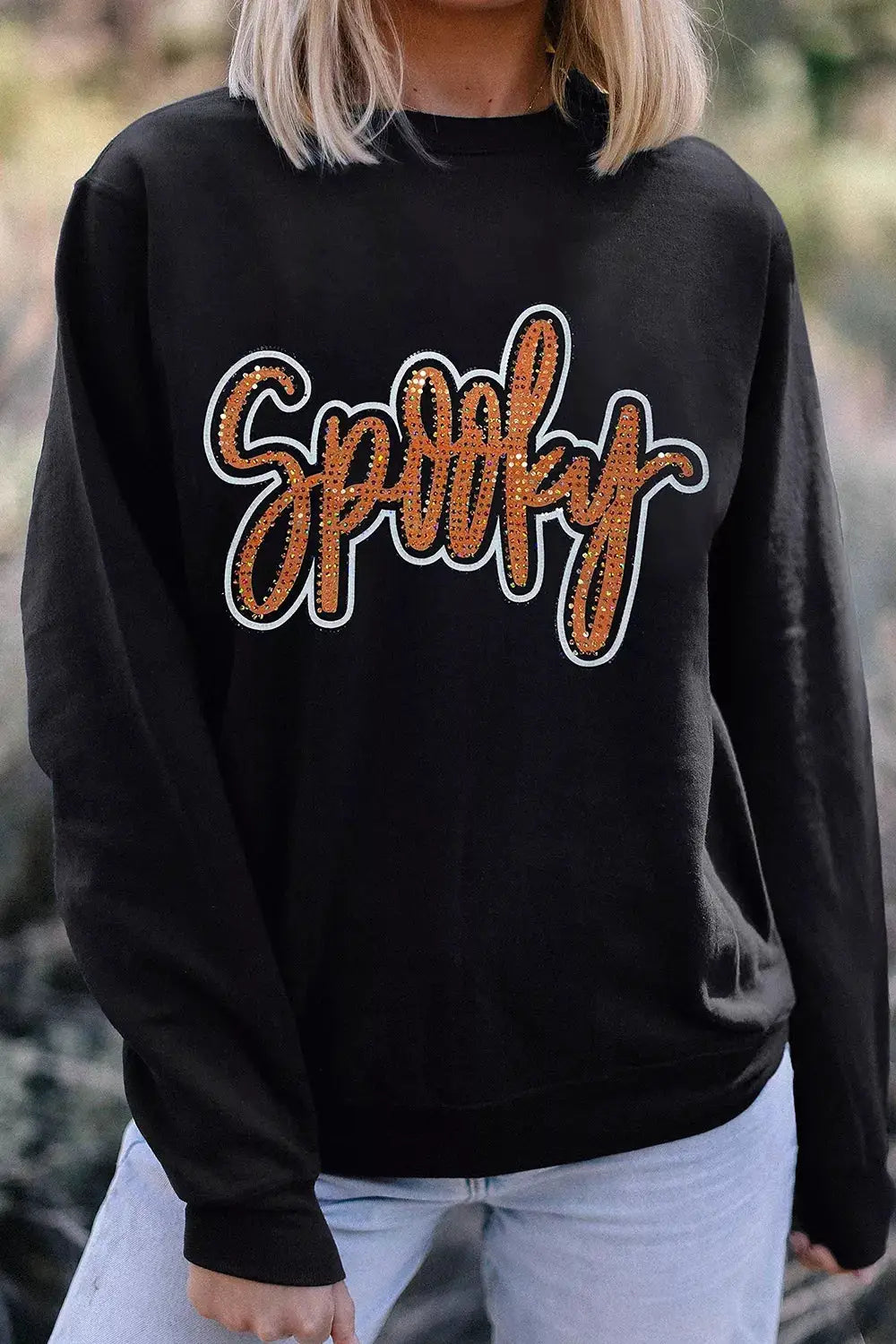 Spooky Rhinestone Drop Shoulder Sweatshirt, black with orange rhinestone lettering.