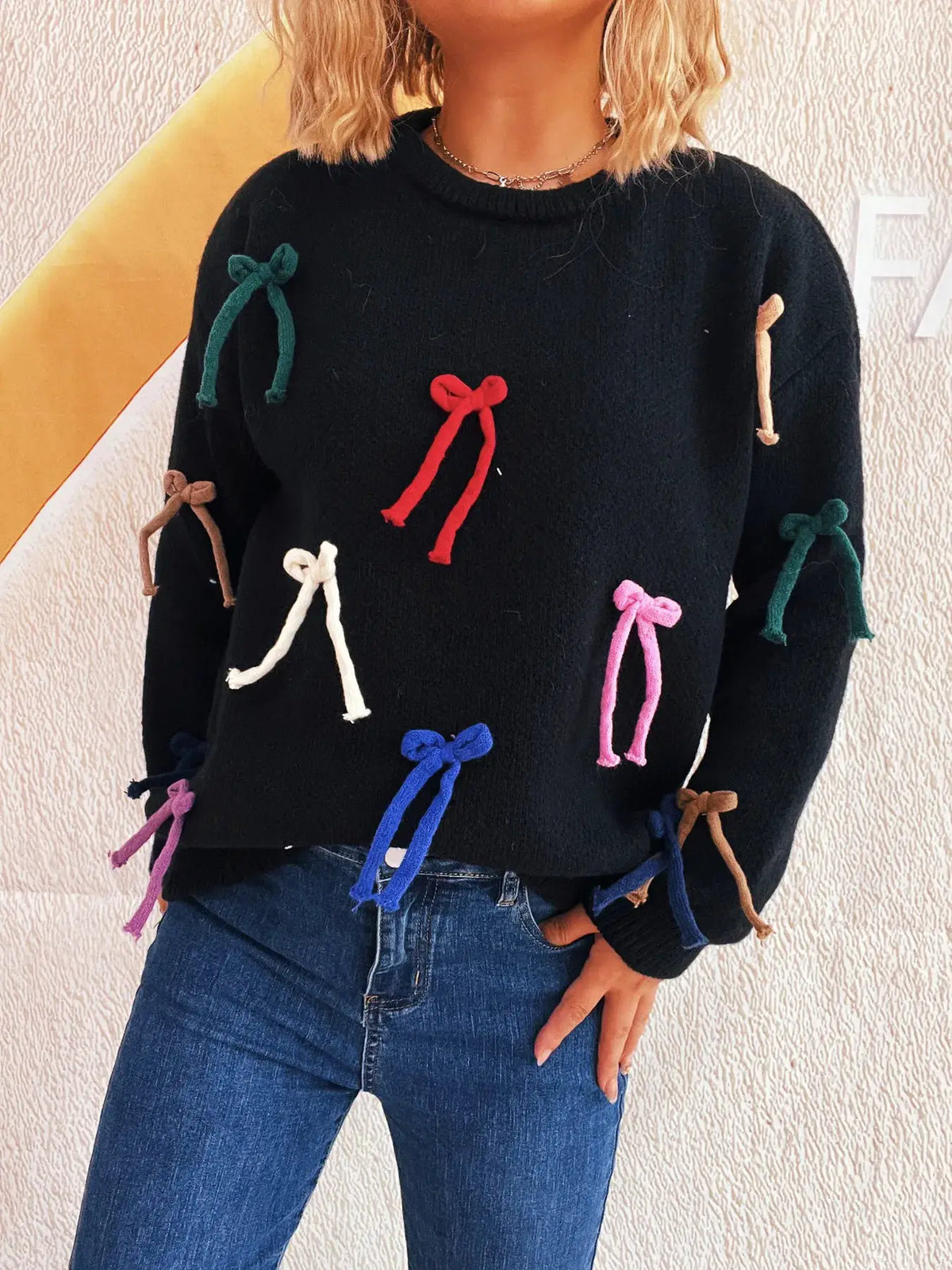 Vibrant Bow Accent Round-Neck Sweater for Women by Trendsi, black knit with multicolor bow accents