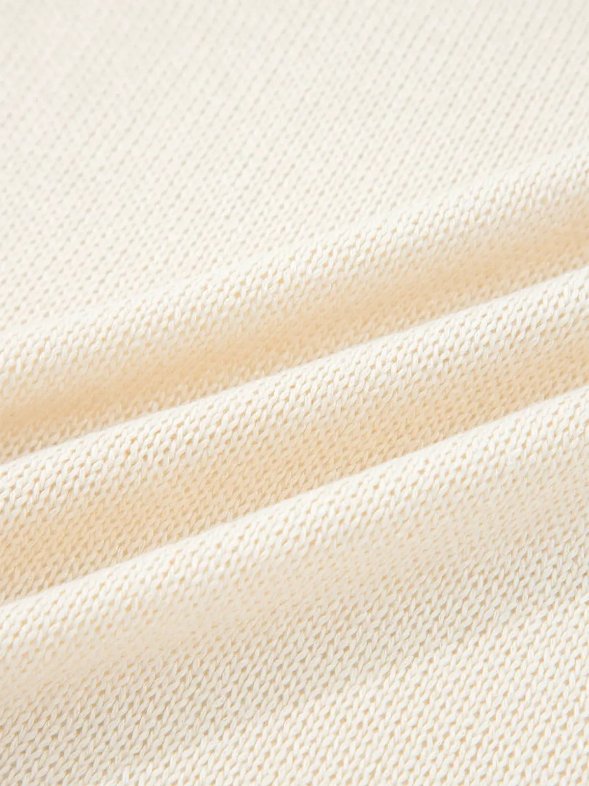 Hollowed Knit Open Front Cardigan fabric close-up in cream with textured knit