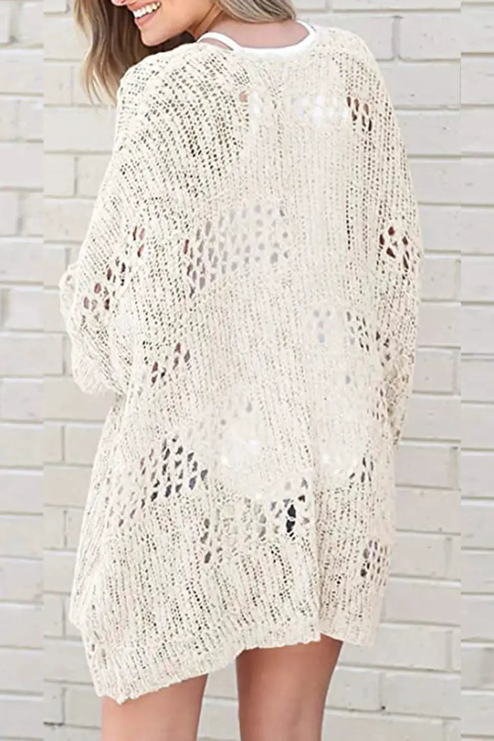 Openwork open-front cream acrylic cardigan by Trendsi; long sleeves, airy knit pattern.