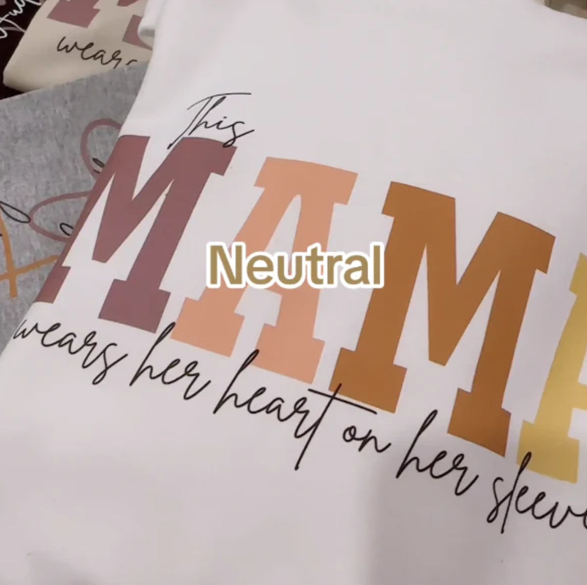 AdTec hoodie with a custom hot-stamped print featuring bold multicolor MTM lettering on white fabric.