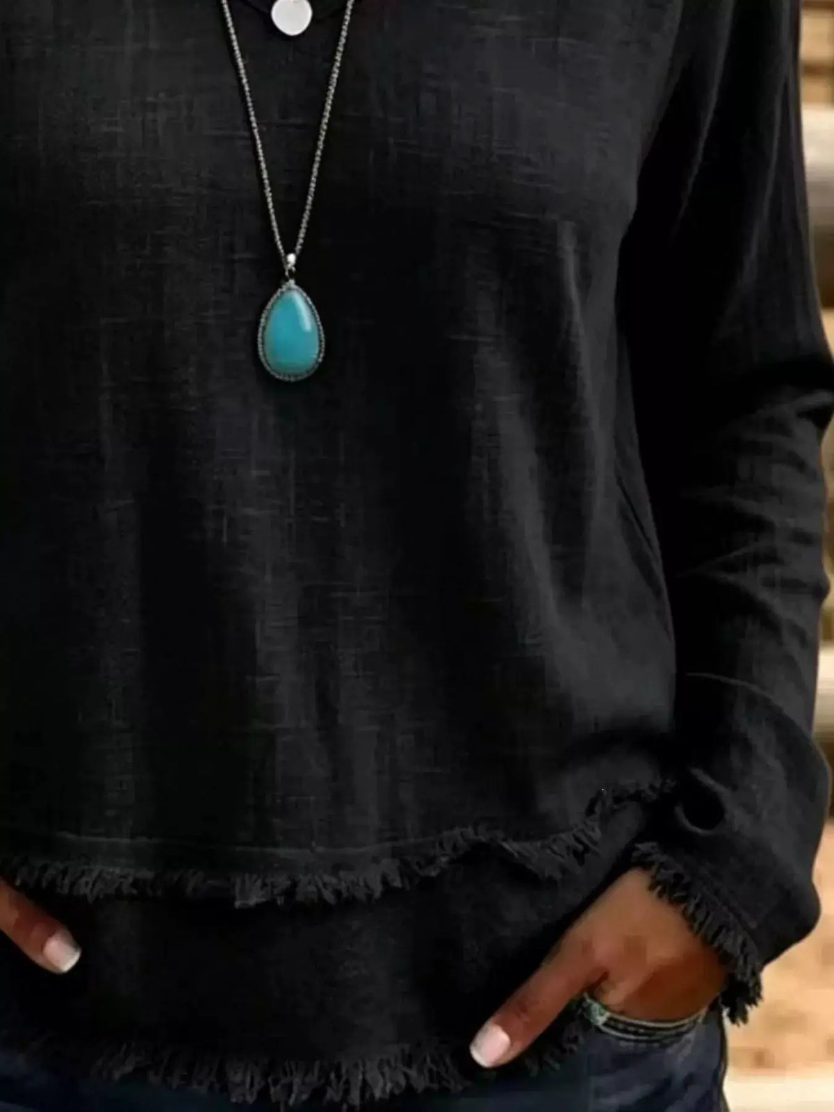 V-Neck Frayed Hem Long Sleeve T-Shirt in black by Trendsi