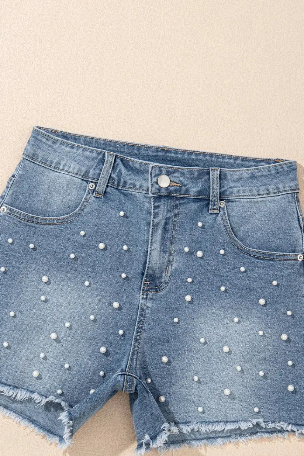 Denim shorts with pearl beads, light-wash cotton blend, raw hem
