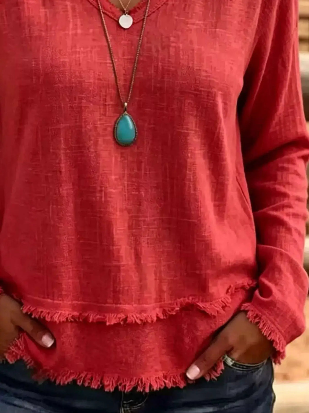 Red V-neck long-sleeve T-shirt with a frayed hem detail