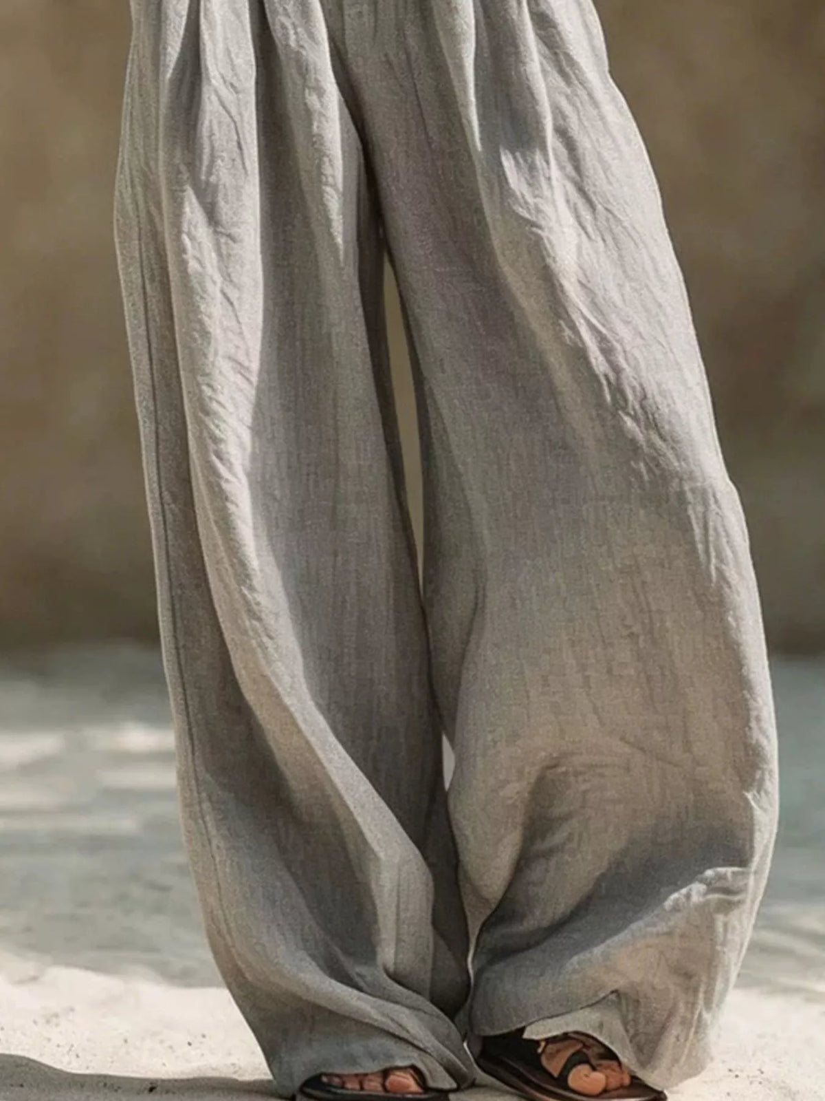 Trendsi plus-size wide-leg palazzo pants with elastic waistband, light gray crinkled fabric