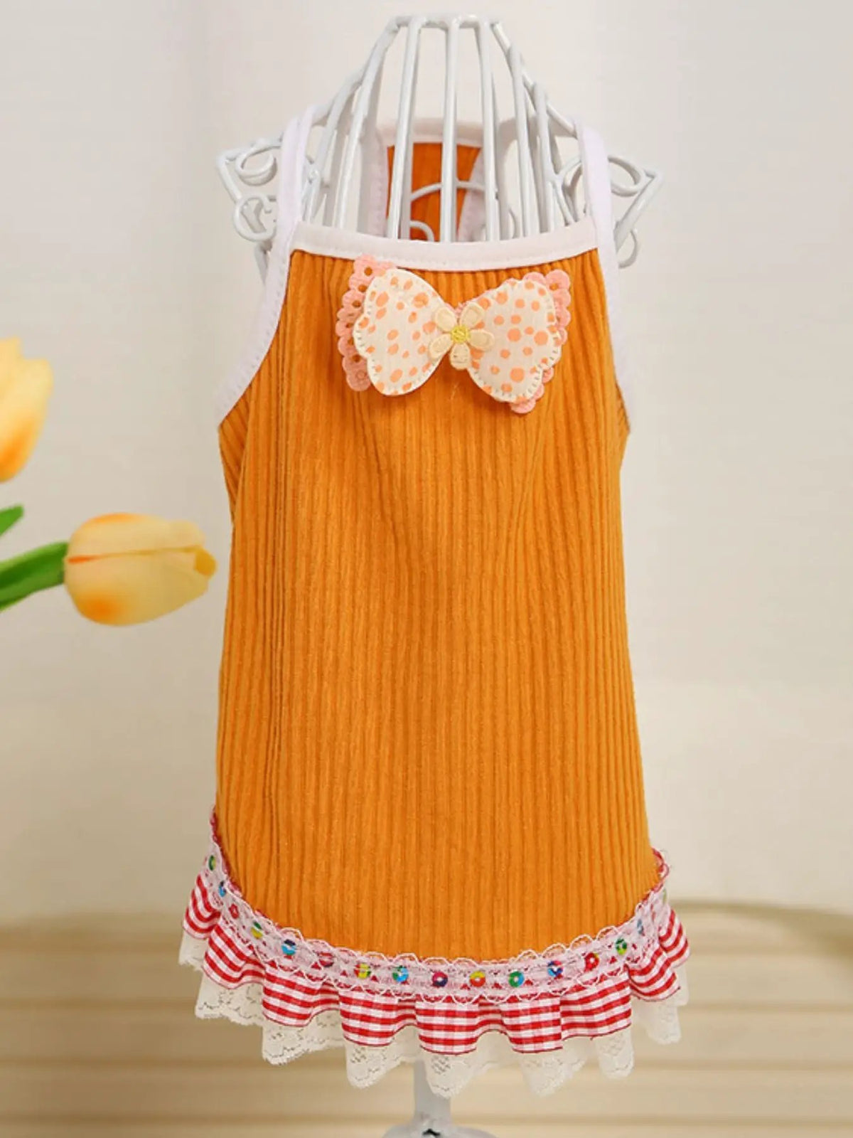 Bowknot Ruffled Hem Pet Top in orange ribbed fabric with white trim and pink bow by Trendsi