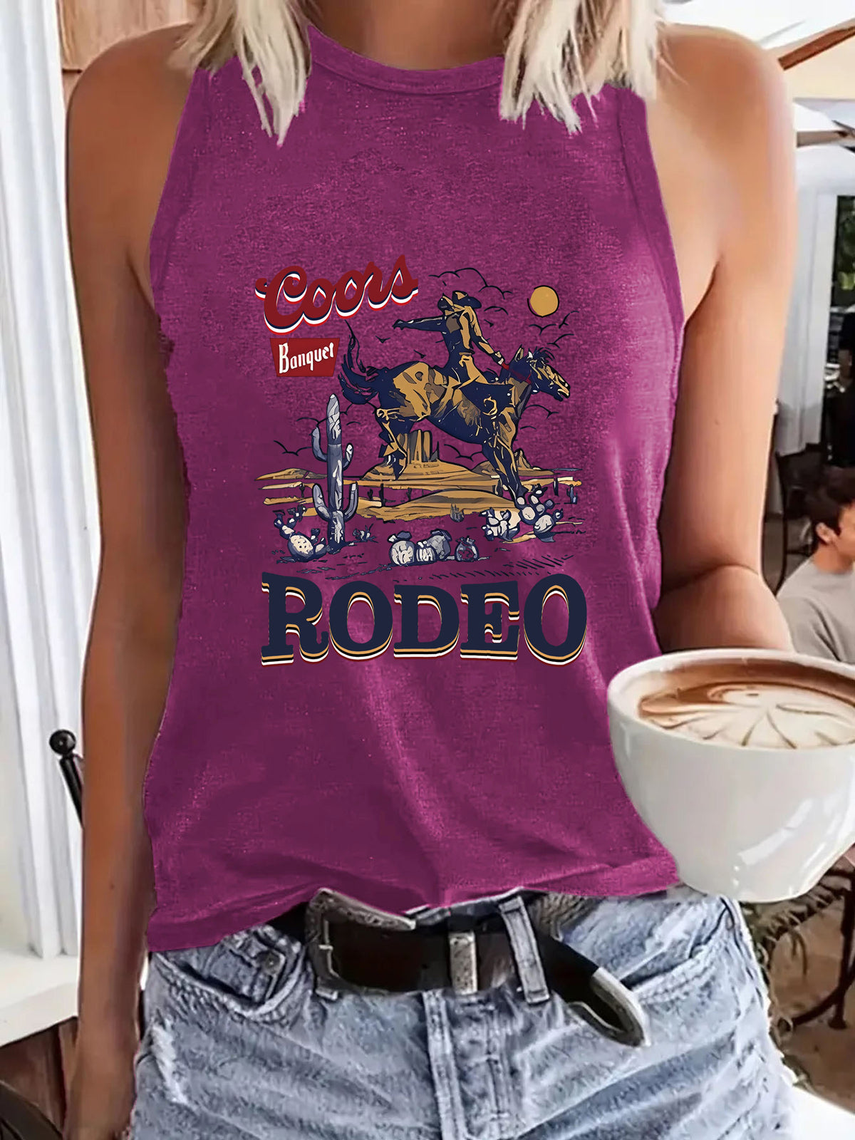 Purple Western sleeveless top with rodeo desert scene and bold RODEO text