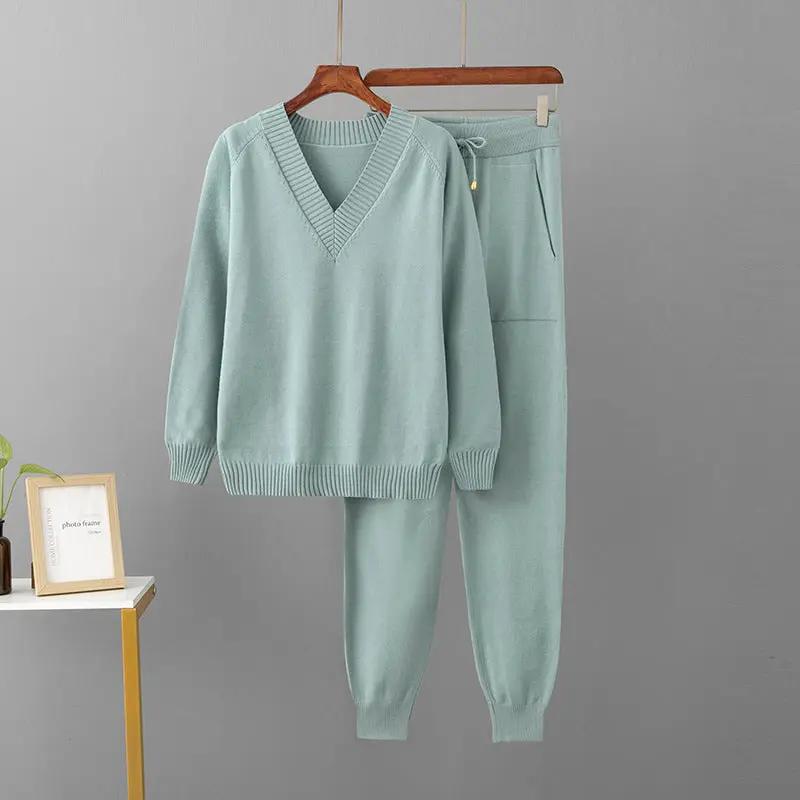 Classic two-piece knitwear set by eprolo: light seafoam V-neck sweater with ribbed cuffs and matching jogger pants