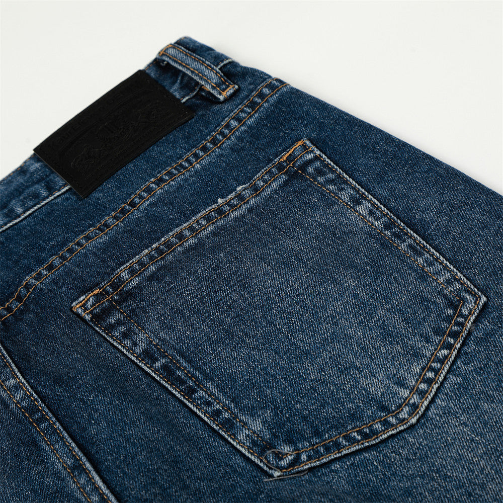 Washed denim straight-leg jeans in blue with contrast stitching and back pocket detail