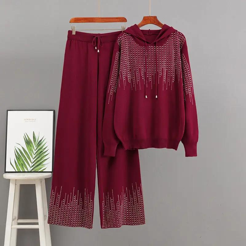 Ensemble by eprolo: burgundy hooded knit sweater with bead pattern and matching wide-leg pants.