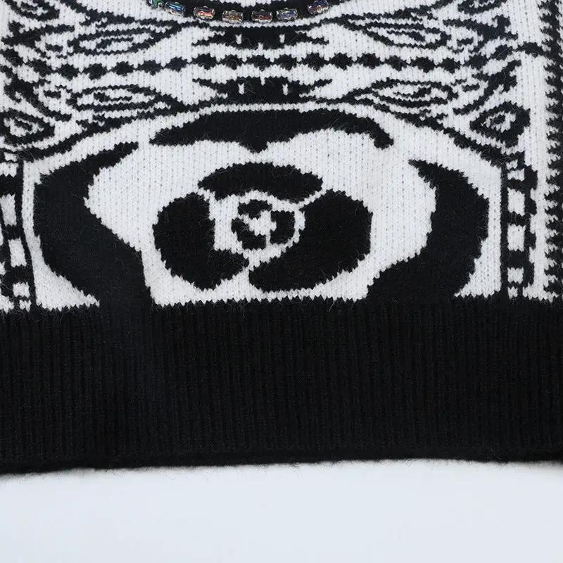Women's soft knit pullover sweater in black and white pattern with ribbed hem