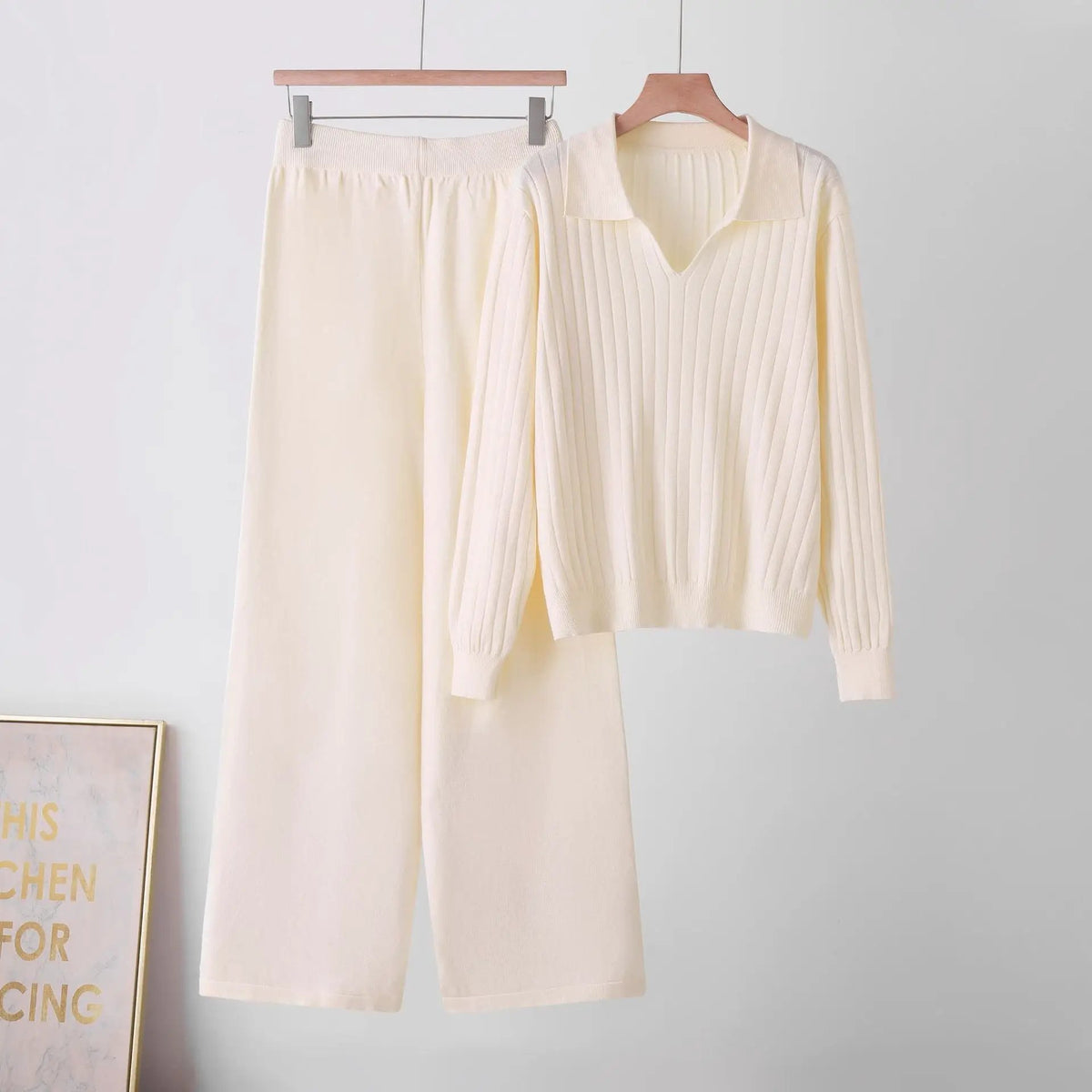 Matching polo-neck women’s soft knit two-piece set in ivory by eprolo