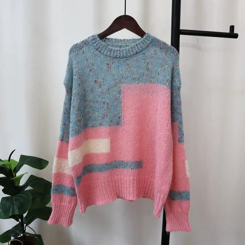 Soft knit relaxed-fit everyday pullover sweater in blue-speckled and pink color blocks on a hanger.