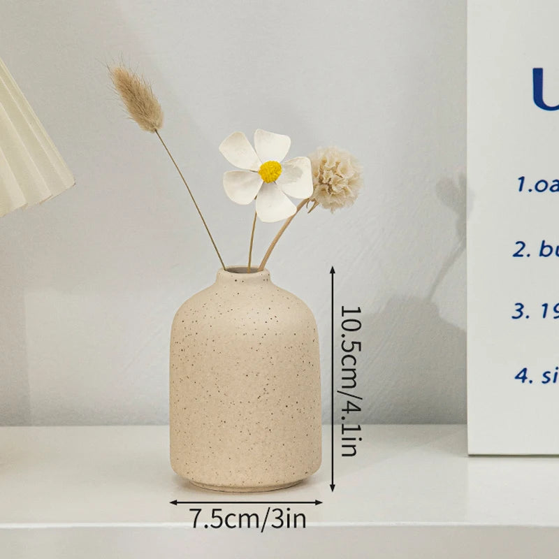 Ceramic speckled beige flower vase with dried stems, desktop decor