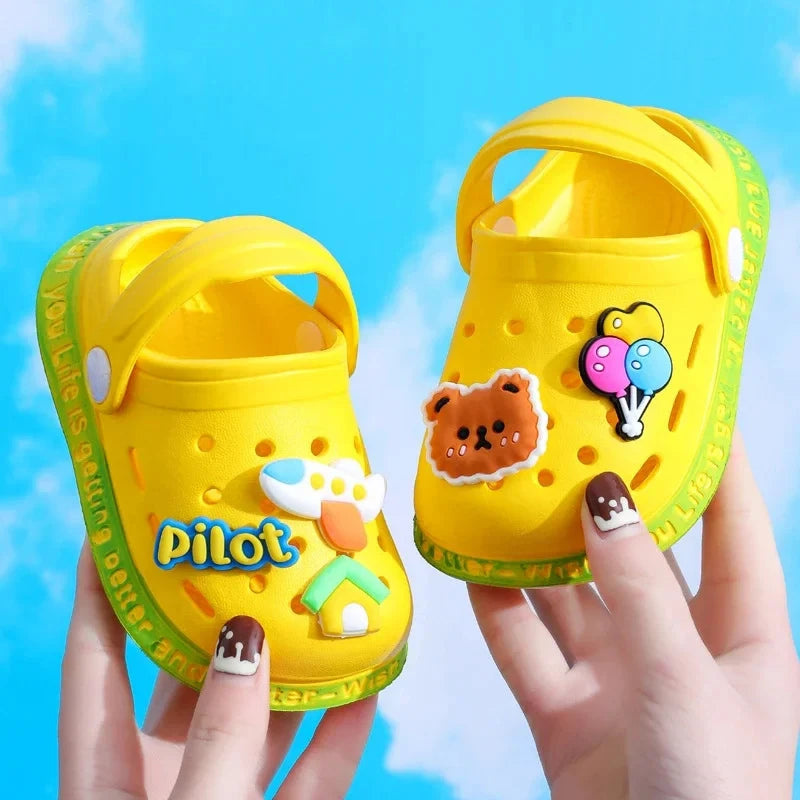 Kids Cartoon Summer Sandals; bright yellow jelly sandals with bear, balloons, airplane patches and green strap