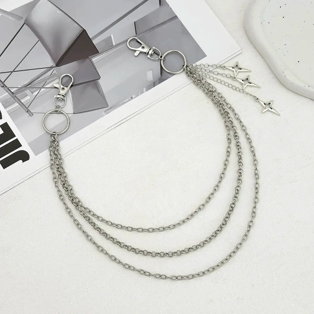 Waist chain belt with three silver metal chains and star charms; punk style hip jewelry