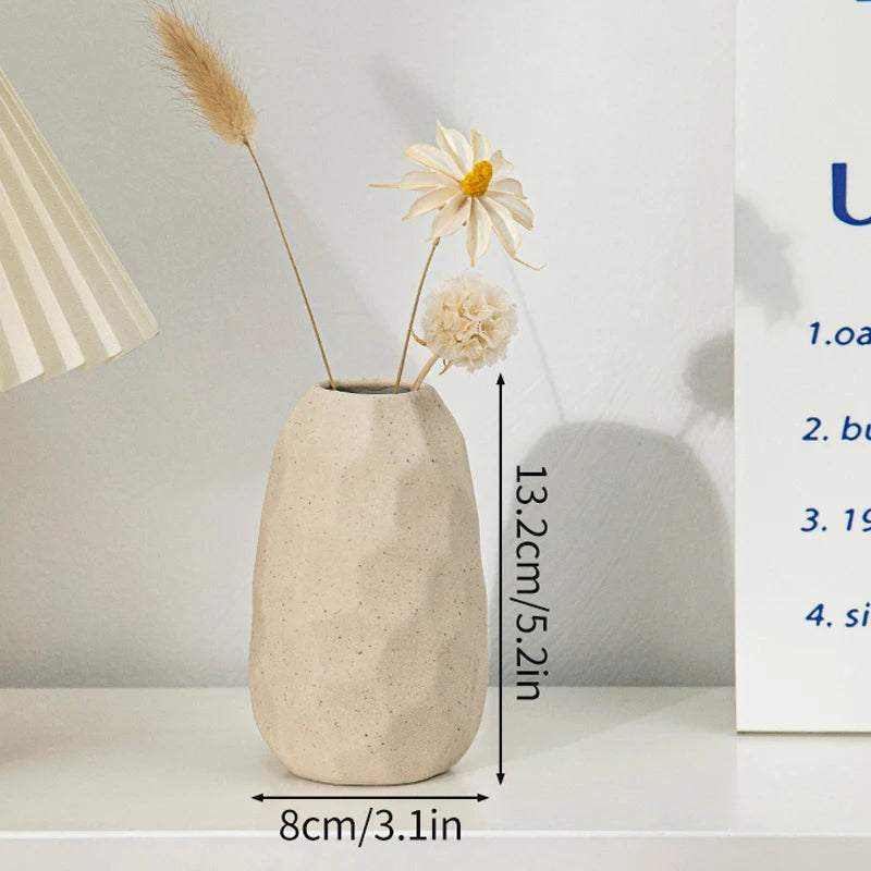 Ceramic flower vase; beige speckled, rounded tall design with dried flower stems