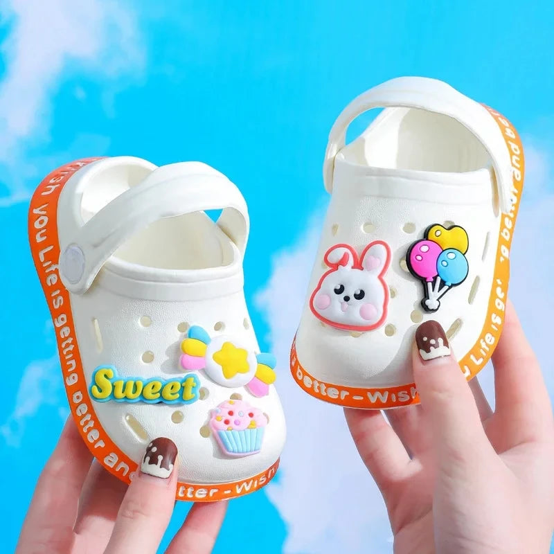 Kids Cartoon Summer Sandals pair in white with orange strap and cartoon decals