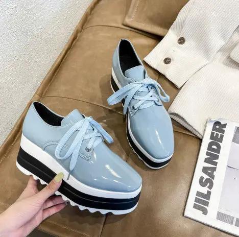 Womens pair of light blue patent leather lace-up square-toe platform wedge heels AdTec