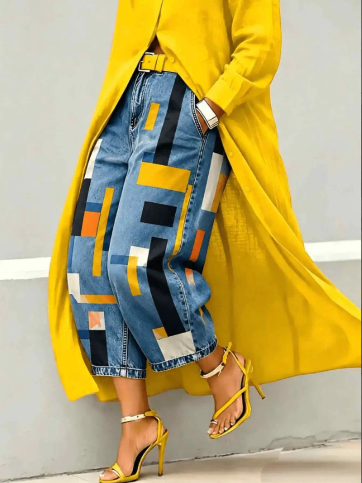 Patchwork denim capri jeans, mid-rise, featuring blue panels with yellow and orange geometric blocks.