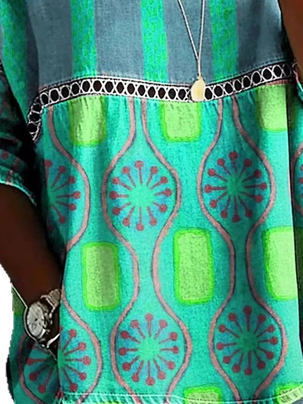 Plus size hollow-out round-neck top in teal-green geometric print by Trendsi