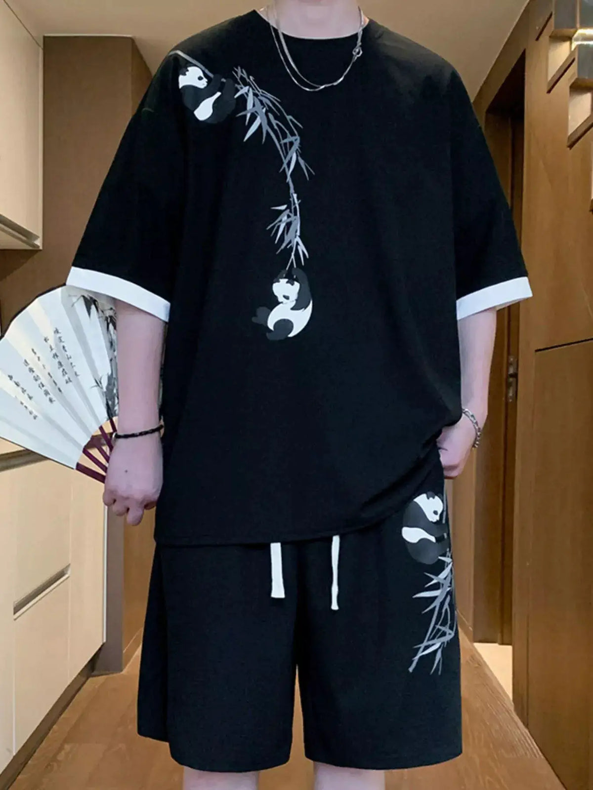 Men's oversized panda bamboo print two-piece tee and shorts set by Trendsi, black with gray bamboo accents
