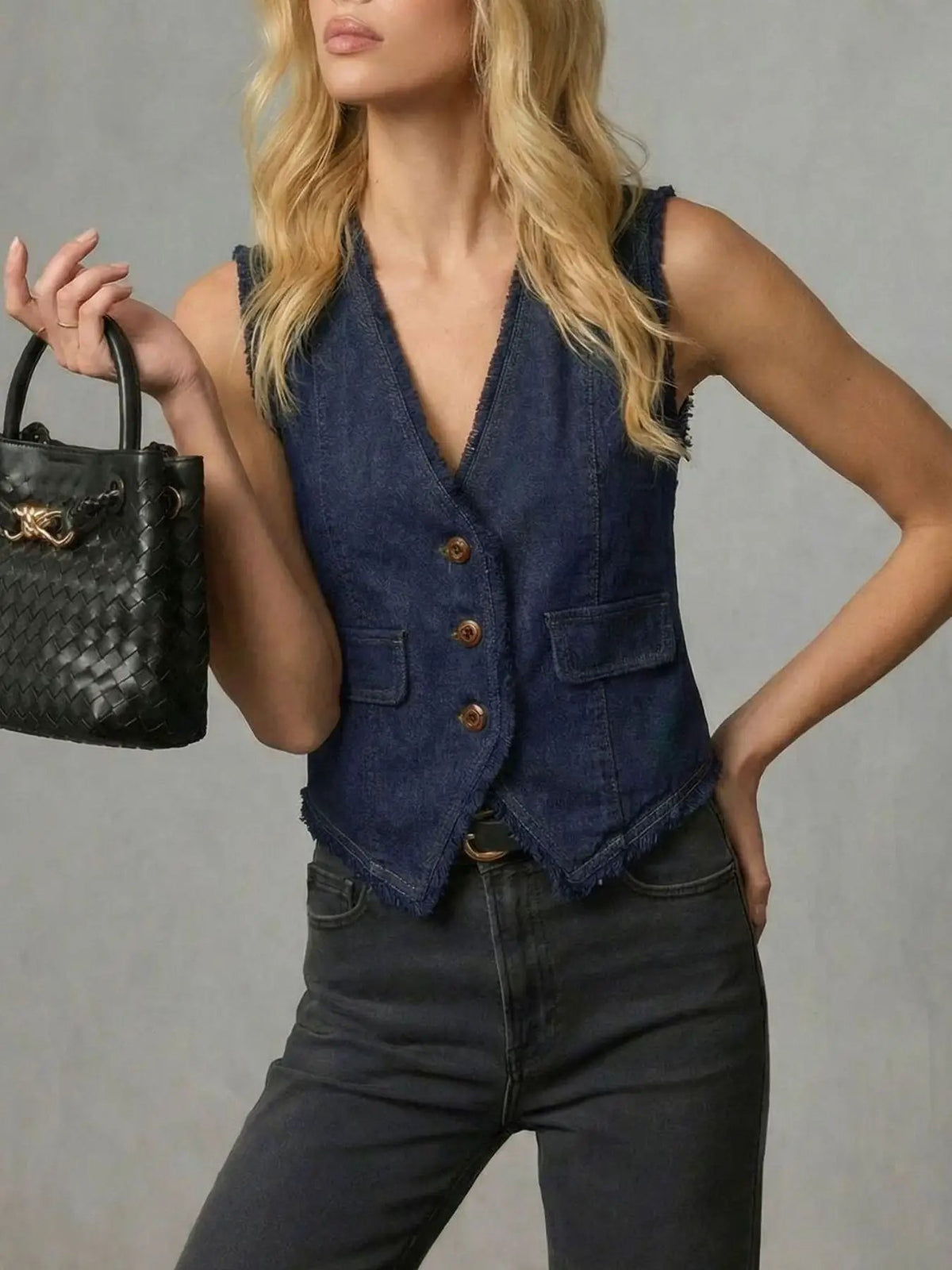 Womens frayed-hem denim vest with button-front closure, sleeveless design and side pockets in dark indigo denim