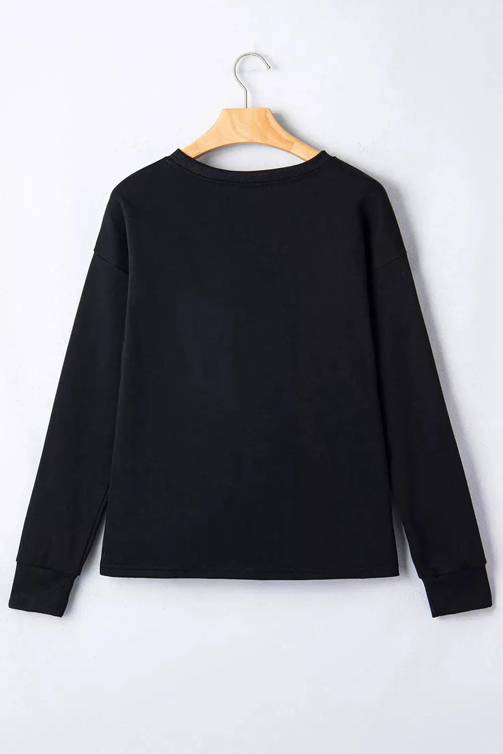 Rhinestone Pumpkin Long Sleeve Sweatshirt, black, back view on wooden hanger