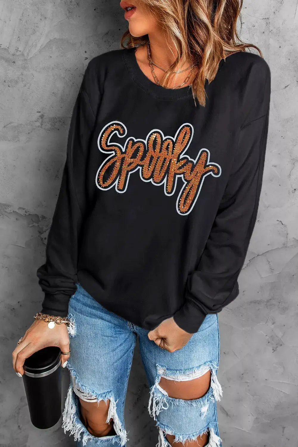 Spooky Rhinestone Drop Shoulder Sweatshirt in black with orange rhinestone script