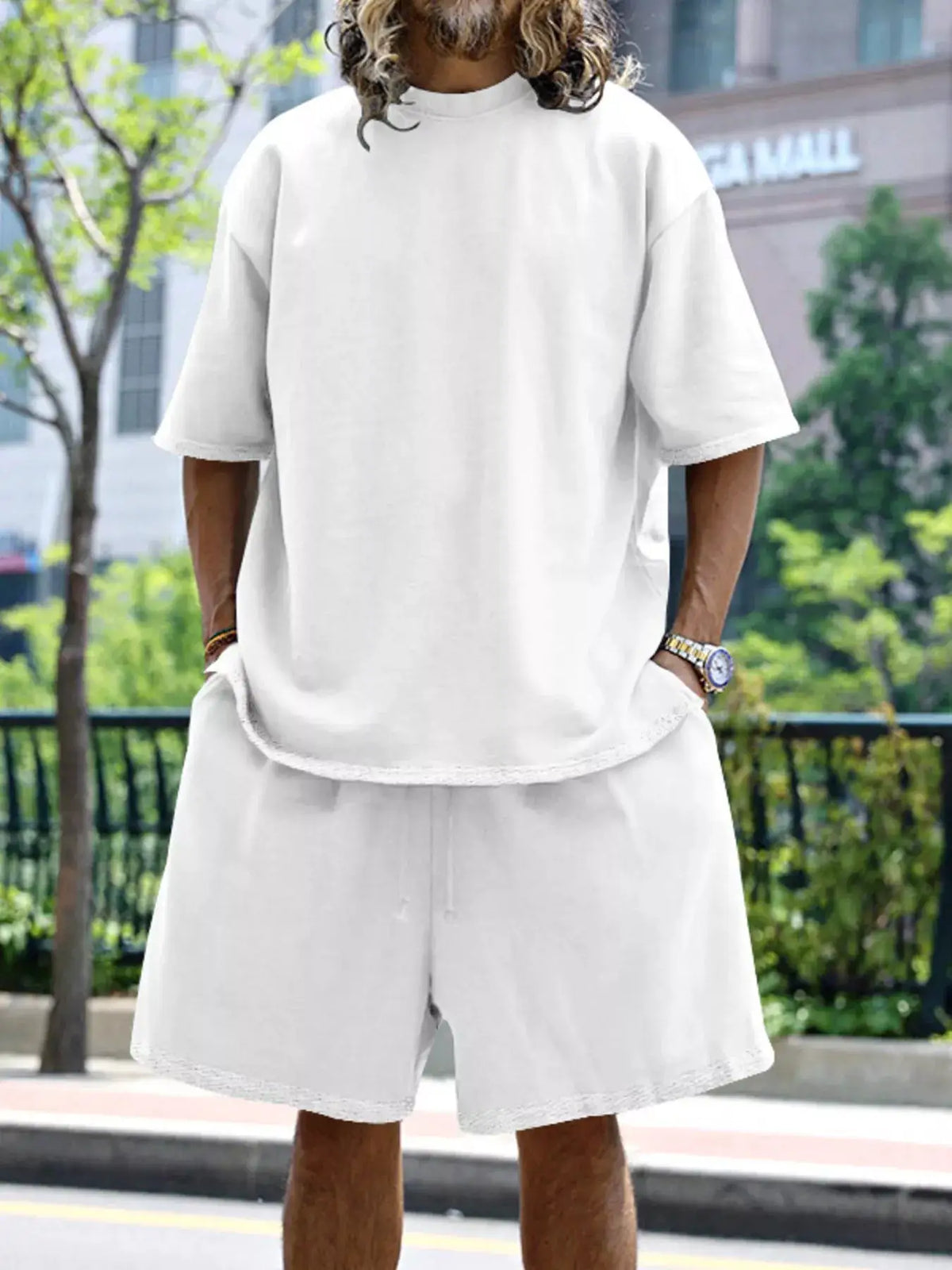 Men's full-size relaxed-fit T-shirt and shorts set with pockets in white.