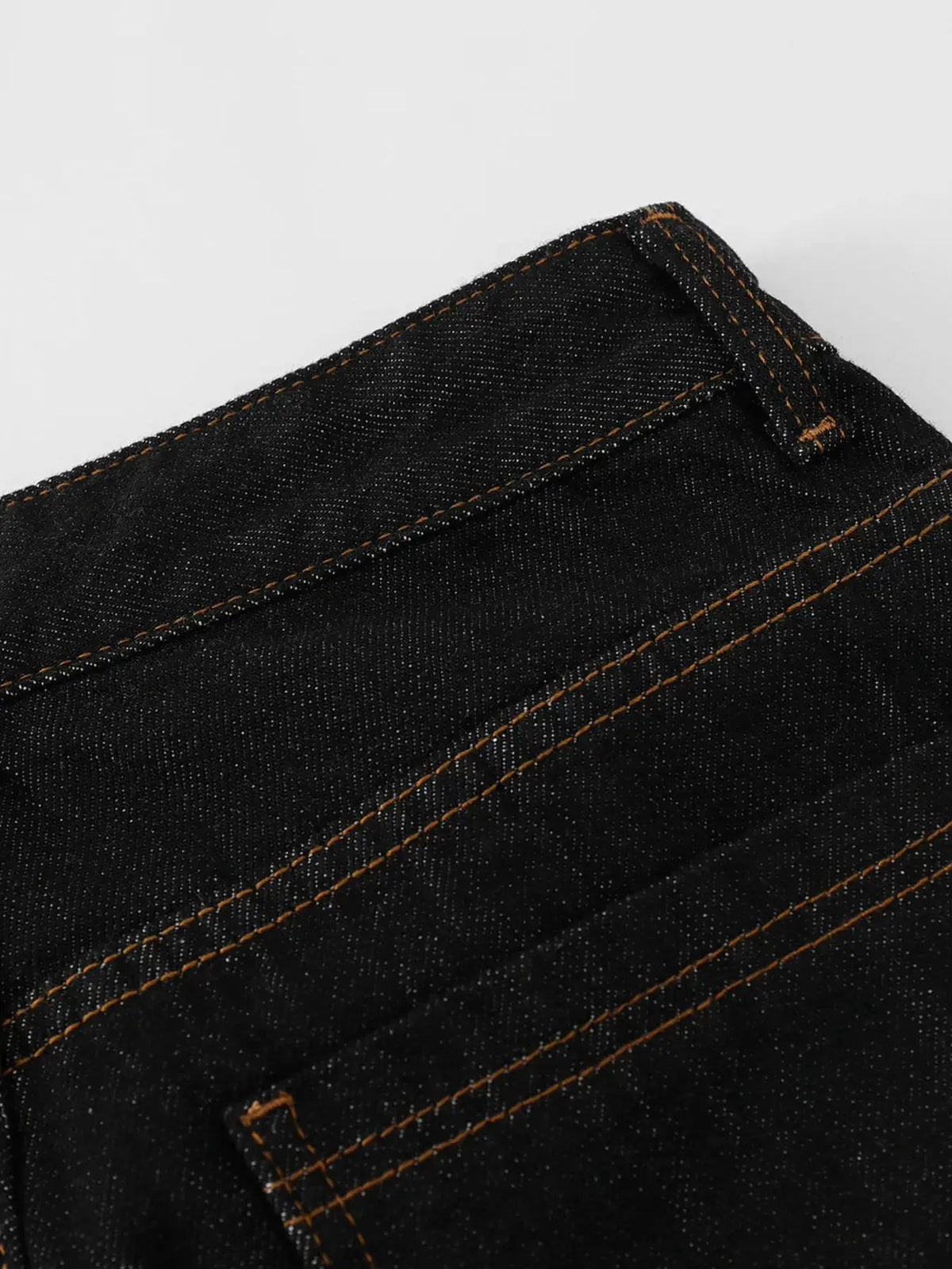 Men's wide-leg denim shorts in dark indigo cotton blend with embroidered pocket detail and orange stitching