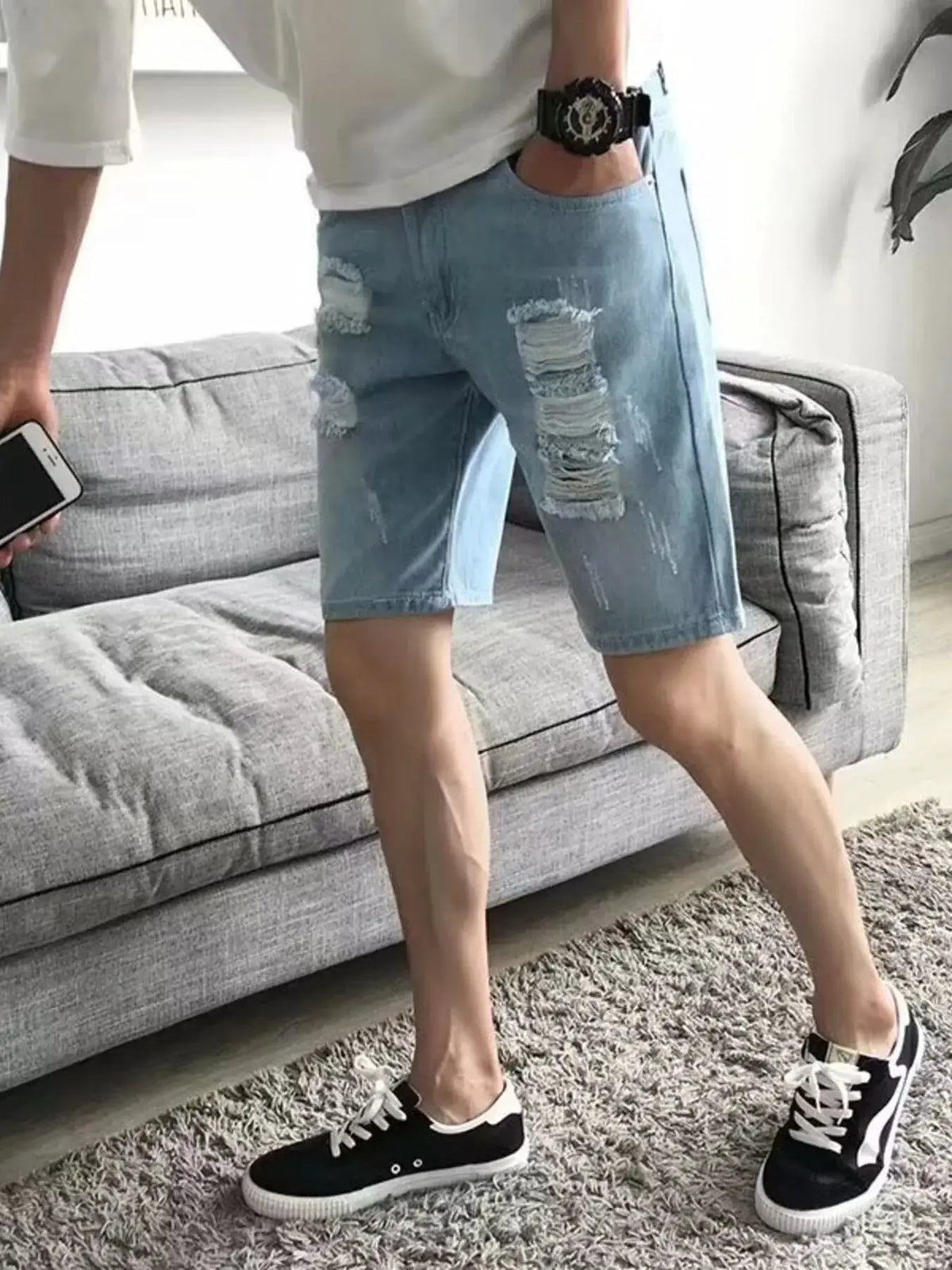 Mens Relaxed Fit Distressed Wash Vintage Denim Shorts, light-wash with ripped knees.