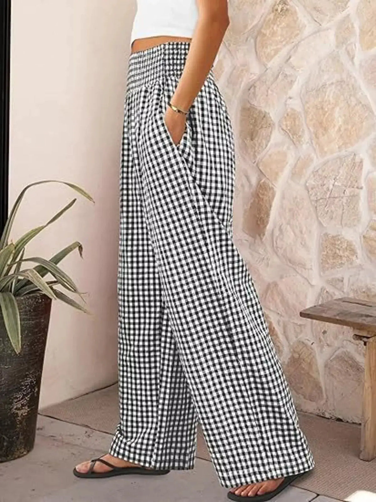 Gingham wide-leg pants in black and white check pattern, long trousers with pockets.