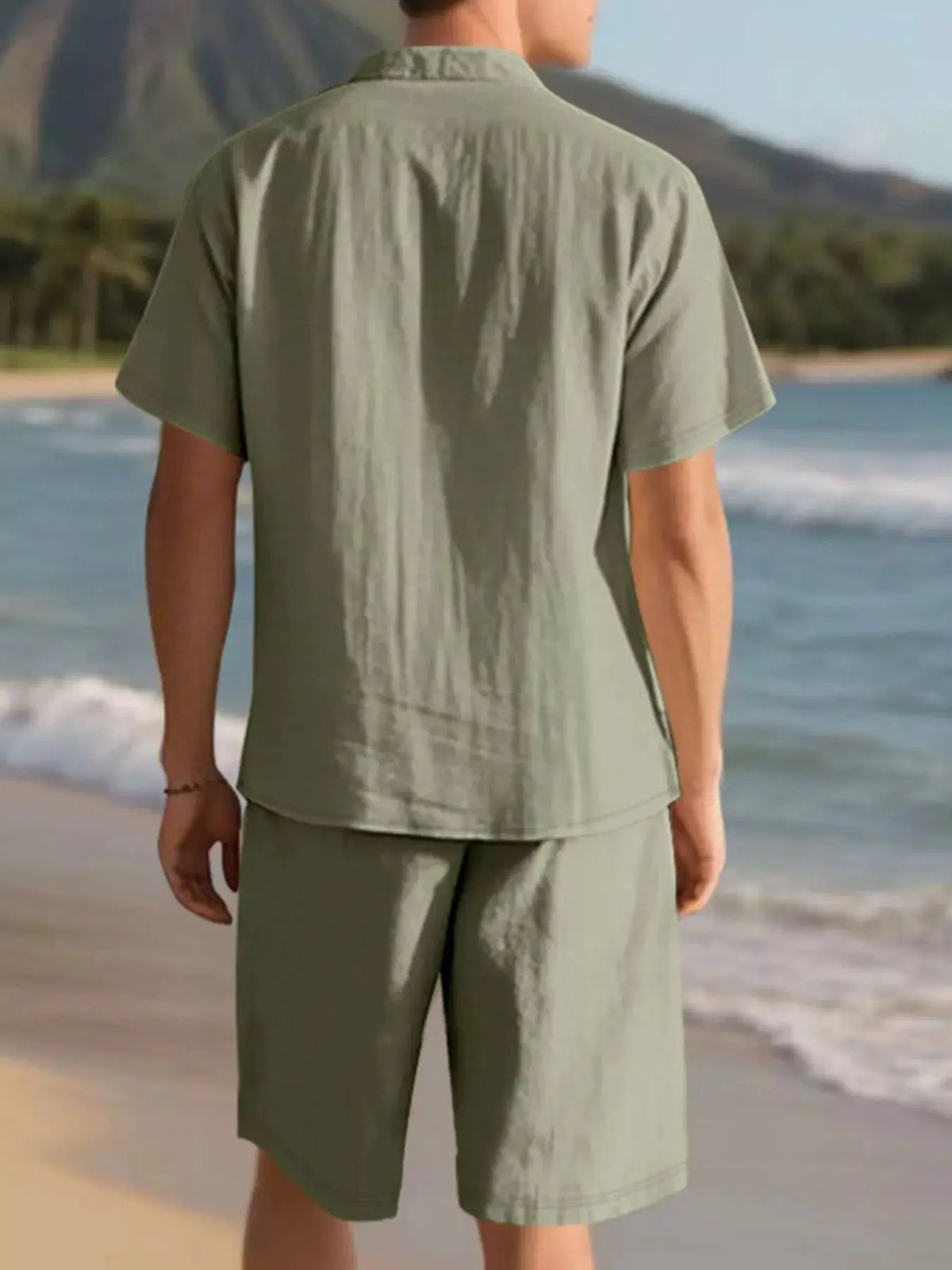 Mens plus-size casual short-sleeve button-up shirt and matching olive green shorts two-piece set, back view.