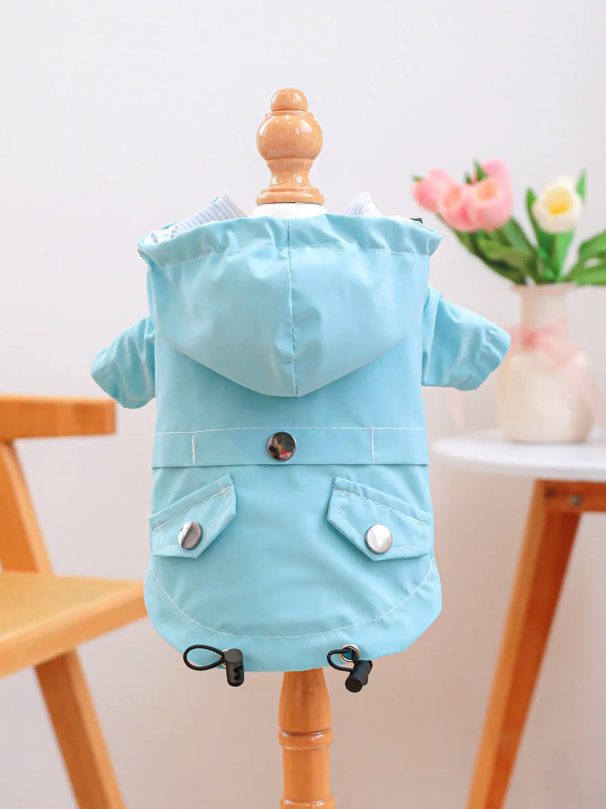 Lightweight waterproof pet raincoat in light blue with hood