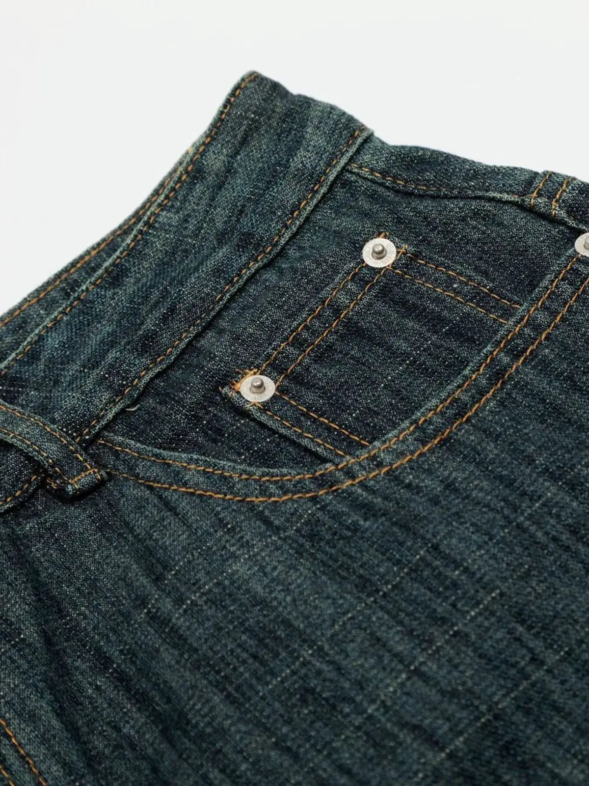 Mens Relaxed Fit Denim Shorts in dark indigo denim with orange contrast stitching and silver rivets