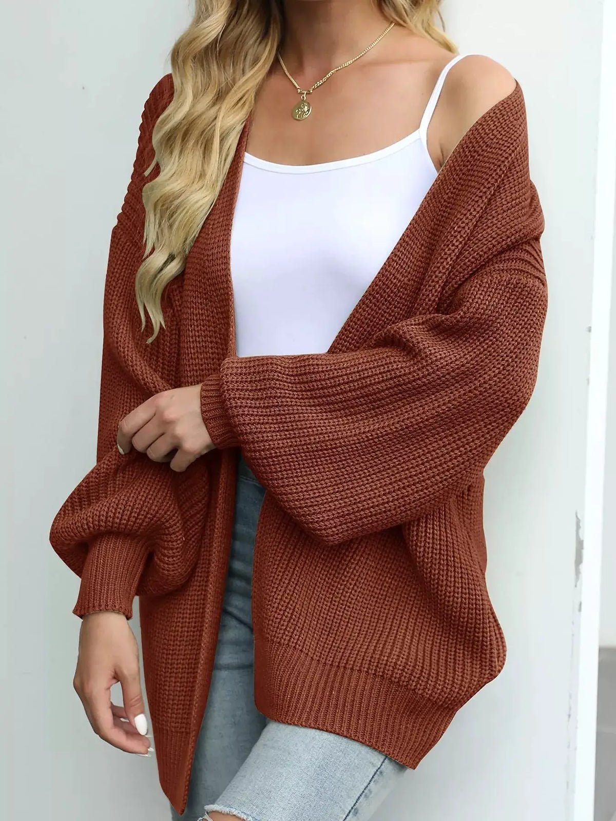 Oversized chunky knit cardigan in rust red with open front and stretch fabric