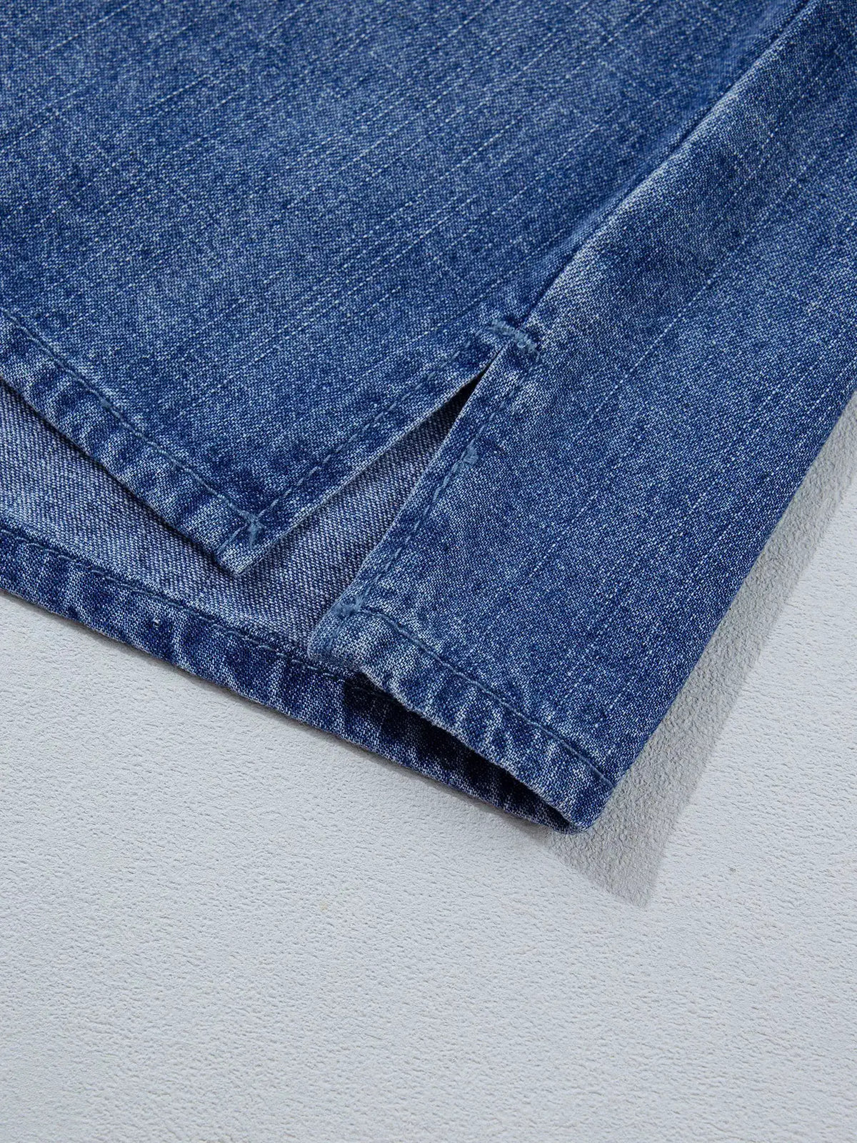 Relaxed blue denim shirt by Trendsi, close-up of hem and seam