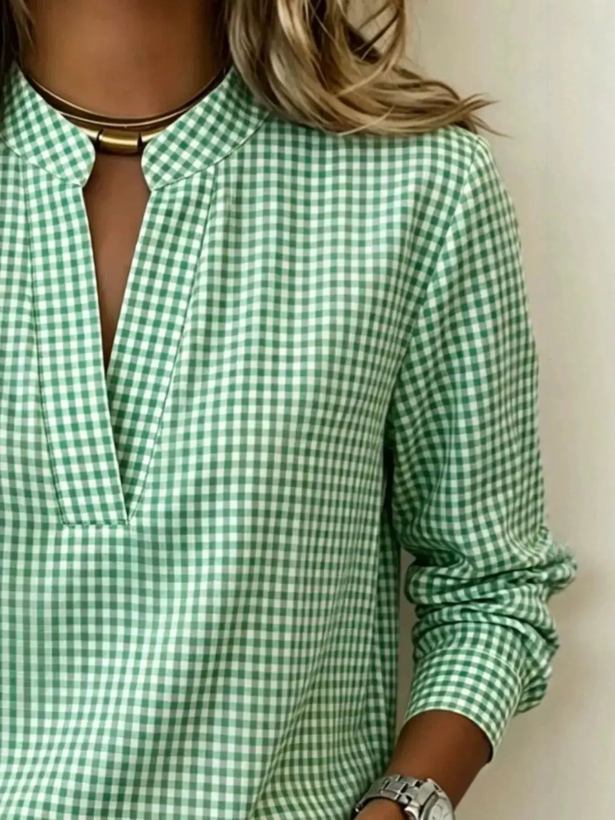 Plus-size plaid notched long-sleeve blouse by Trendsi in green and white gingham.