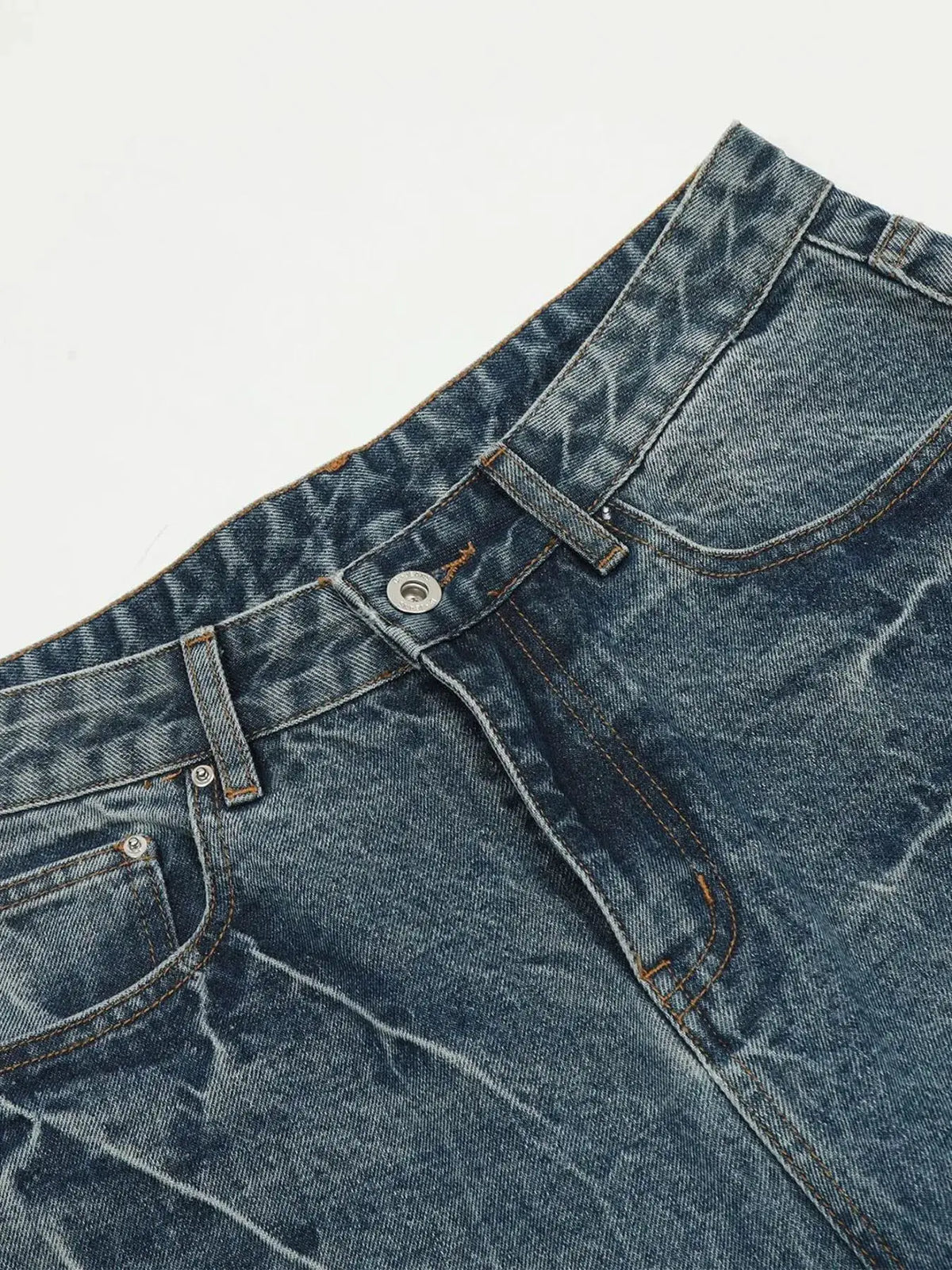 Mens washed wide-leg denim shorts with front zipper pockets in blue denim.