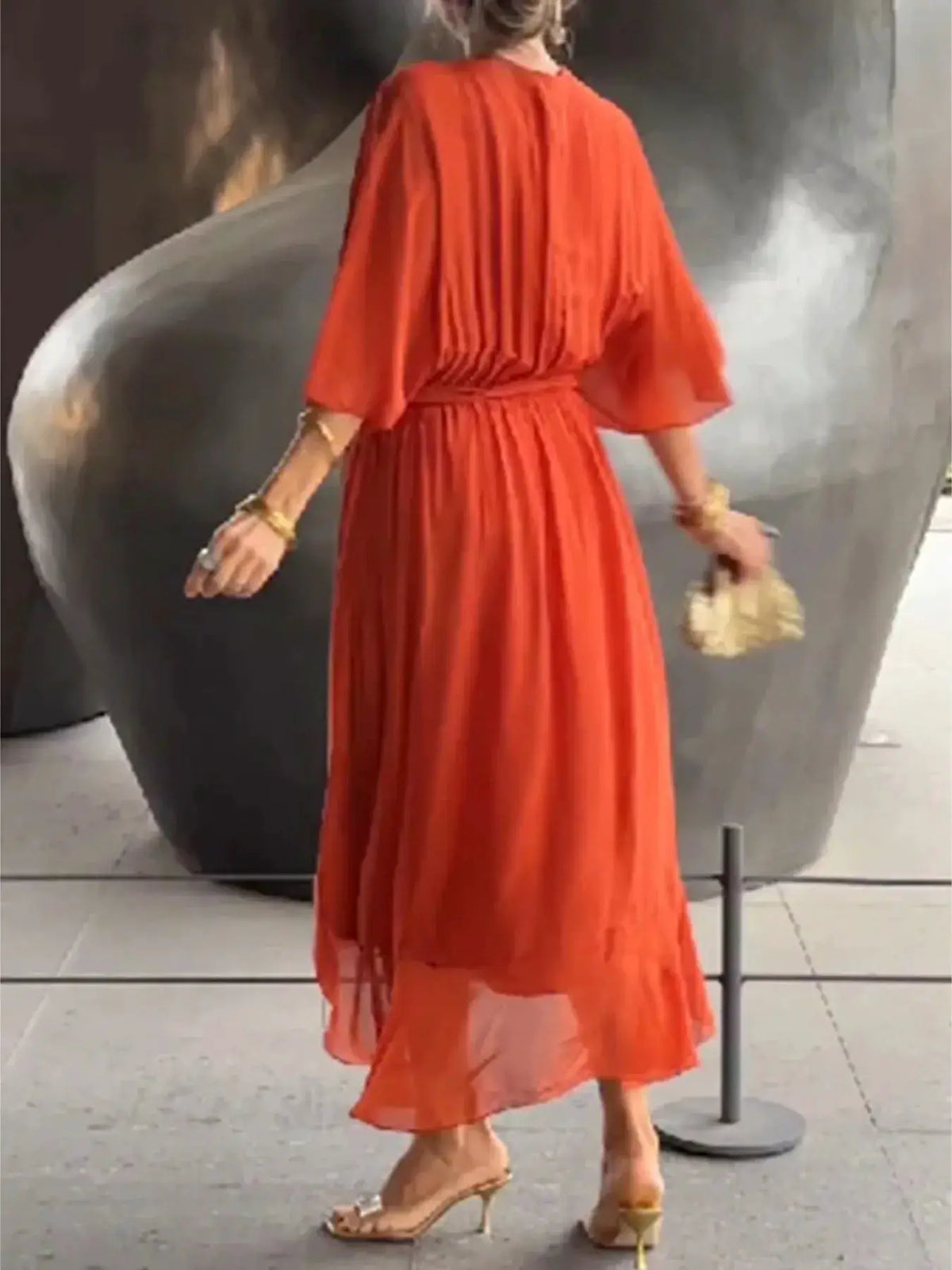 Full-size flowy tie-front midi dress with flutter sleeves in orange-red, plus size.