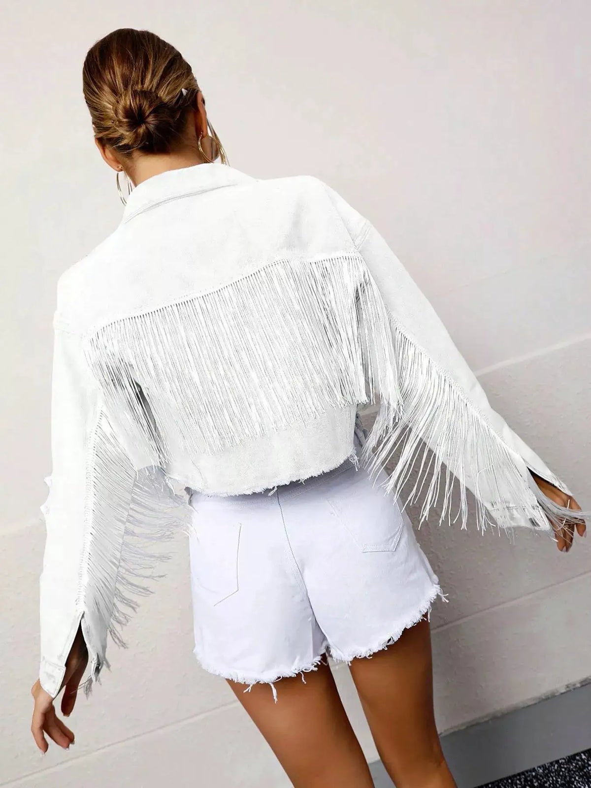 Fringed cropped white denim jacket with tassels and button front