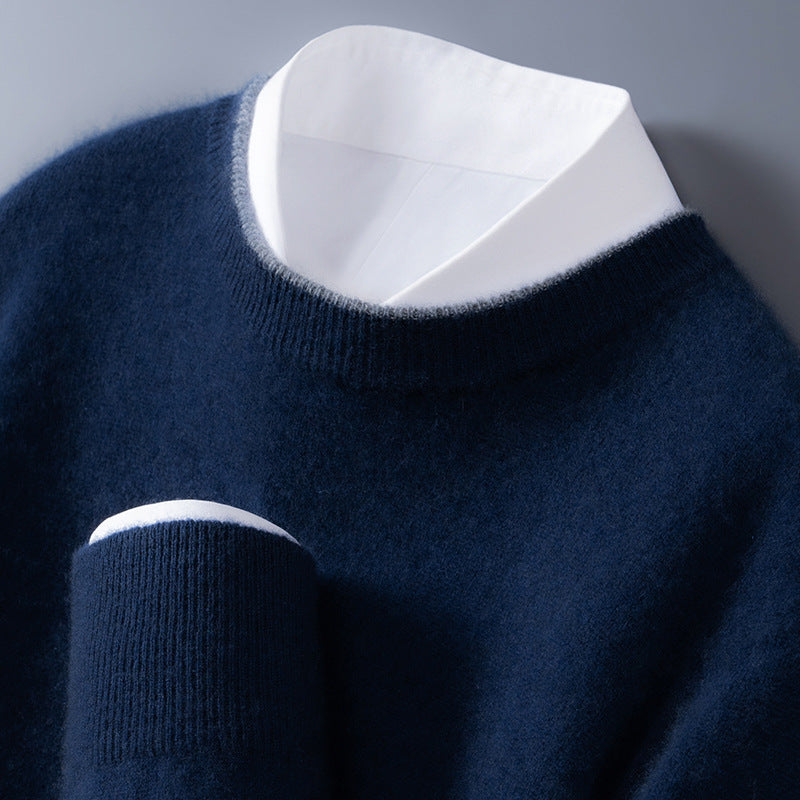 Men's multicolored crew-neck sweater with navy knit fabric and white shirt collar visible.