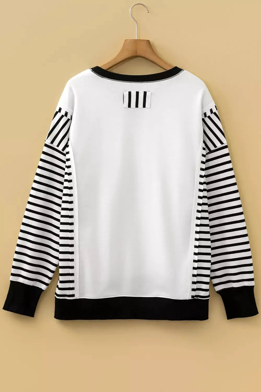 Color Block Striped Cotton Blend Long Sleeve Sweatshirt with white body and black striped sleeves back view