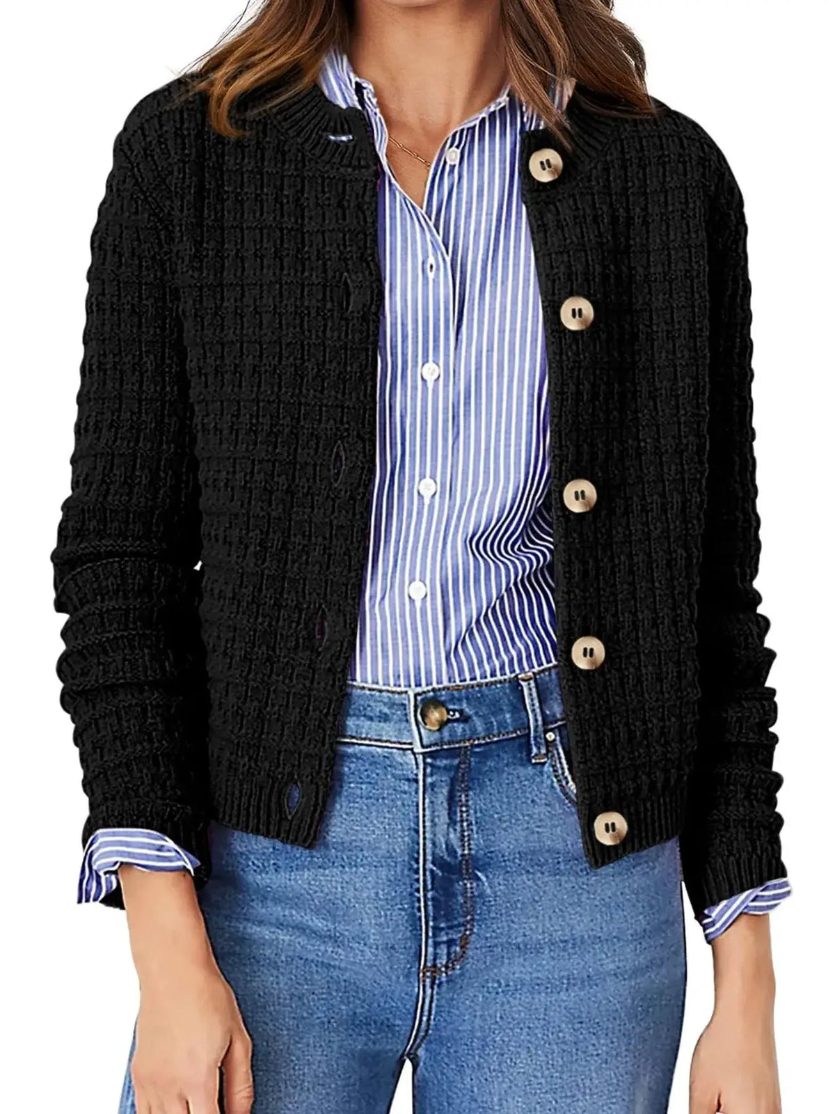 Textured stretchy knit button-front cardigan by Trendsi, black with beige buttons, worn over a blue striped shirt.