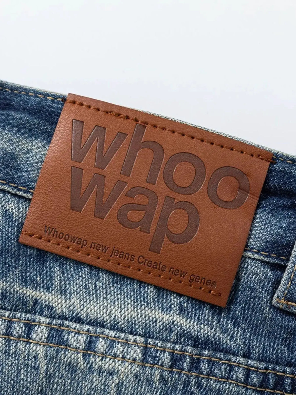 Men's Washed Denim Bermuda Shorts, relaxed fit, pure cotton; close-up shows brown leather patch.