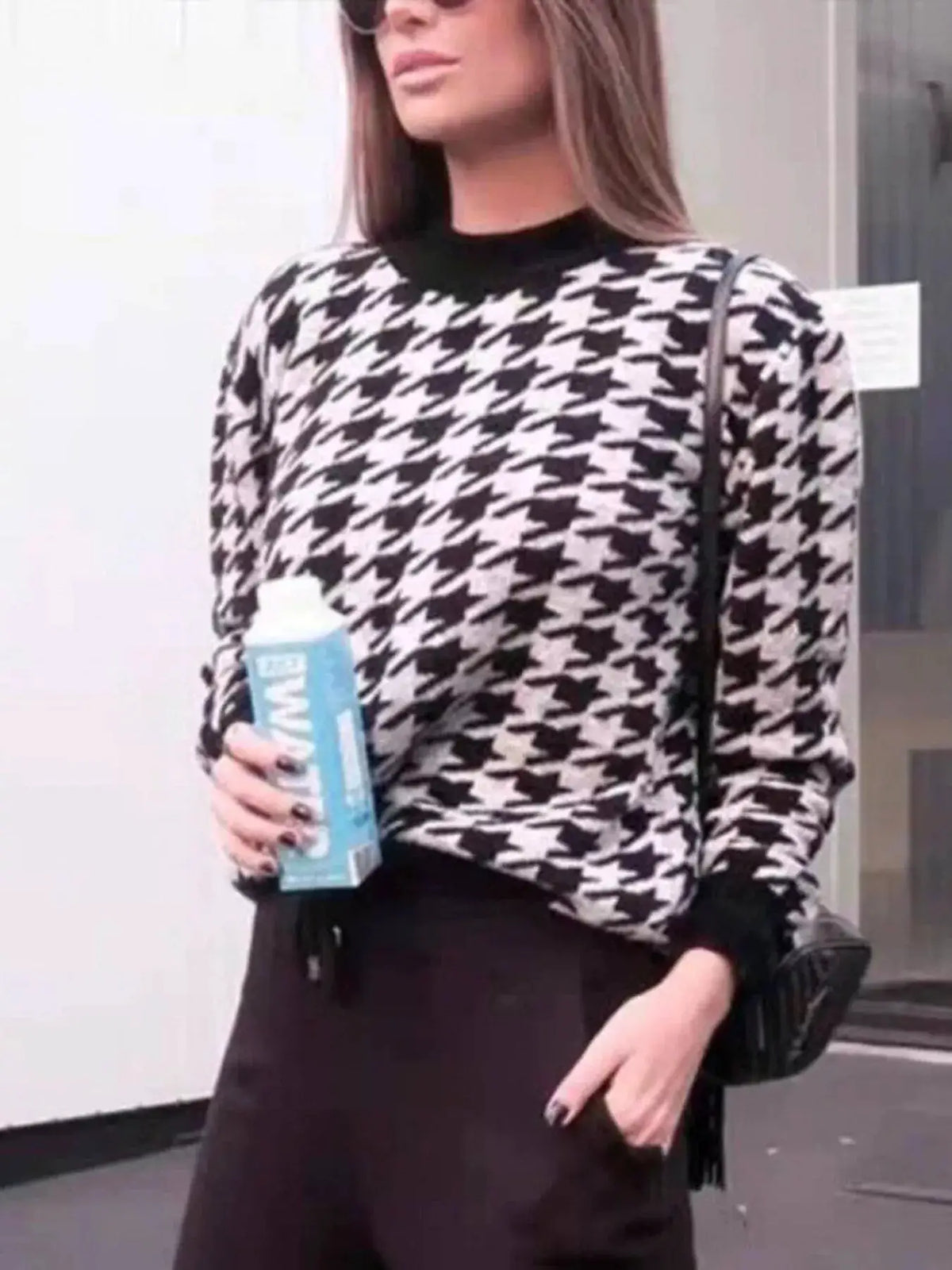 Classic oversized houndstooth sweater by Trendsi in black and white knit for soft everyday comfort.