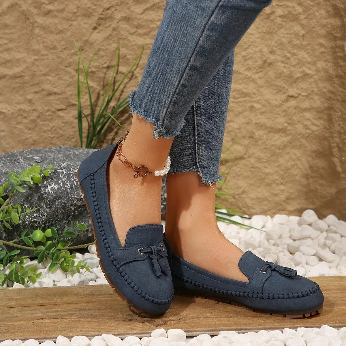 AdTec women's navy round-toe loafers with tassel bow, moccasin stitching, non-slip sole.