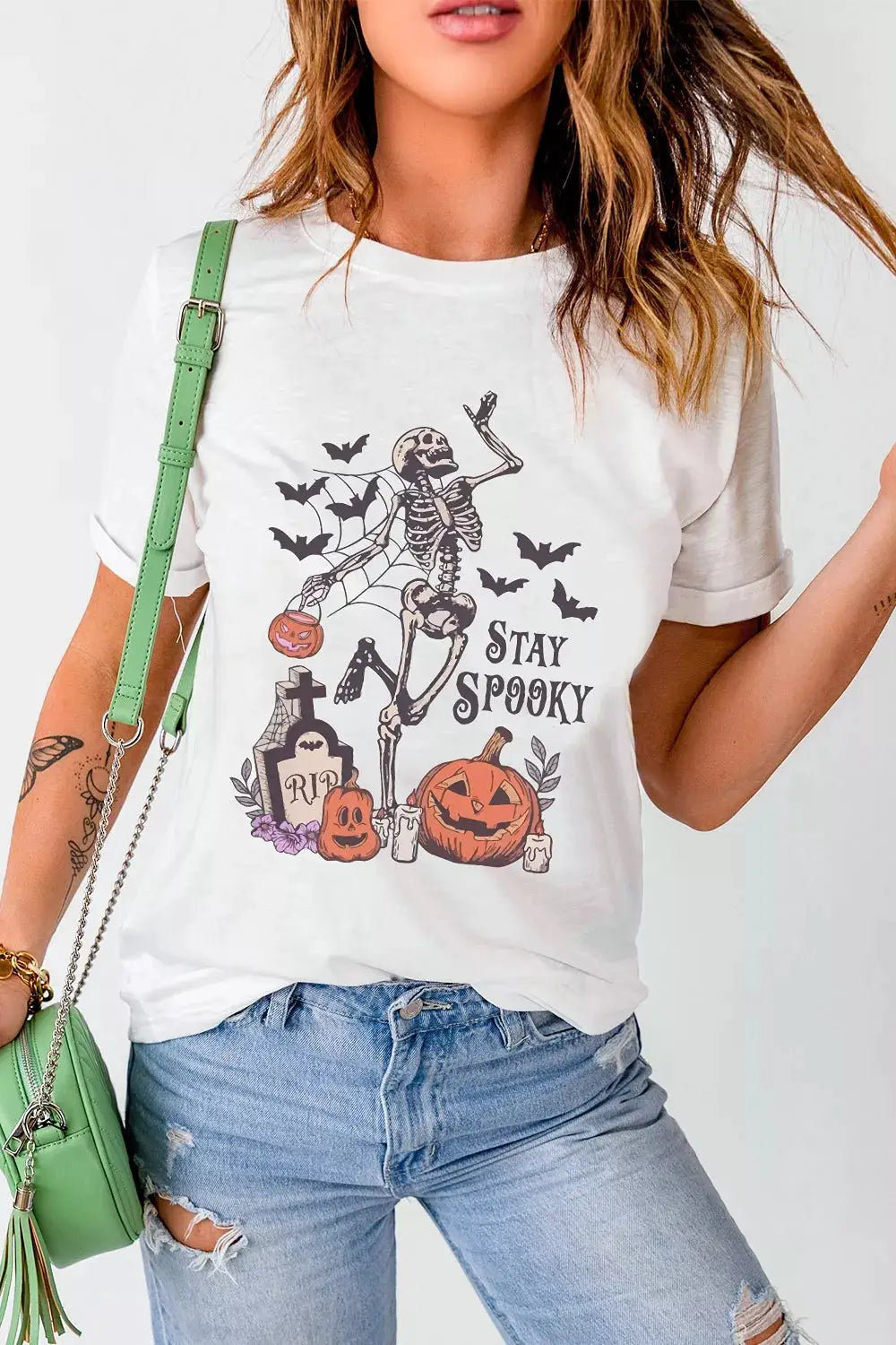 White T-shirt with Stay Spooky Halloween graphic featuring a skeleton, pumpkins and bats