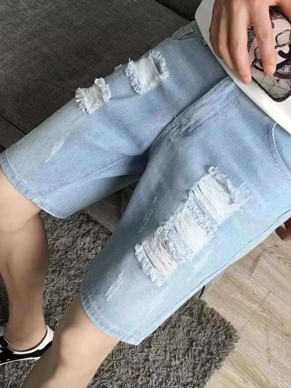 Mens Relaxed Fit Distressed Wash Vintage Denim Shorts in light blue denim with ripped patches